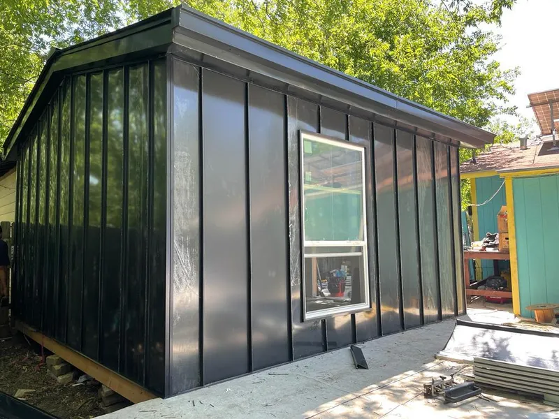 Black standing seam metal wall panels for Roof Inspection in Elgin